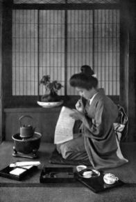 WRITING A LETTER In lotus-land Japan, 1910 by H.G.Ponting