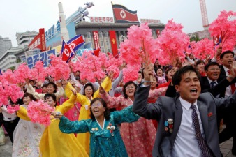 People react as they see North Korean leader Kim Jong Un during a mass rally and parade in the capital's main ceremonial square, a day after the ruling party wrapped up its first congress in 36 years by elevating him to party chairman, in Pyongyang, North Korea, May 10, 2016. (REUTERS/Damir Sagolj)